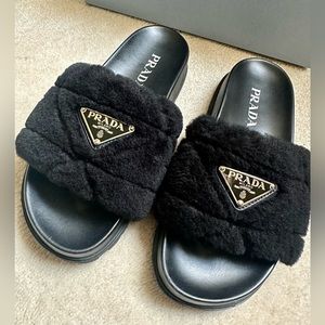 PRADA genuine shearling slide sandal in black, original box and dust bags.
